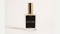 a bottle of perfume with a gold lid