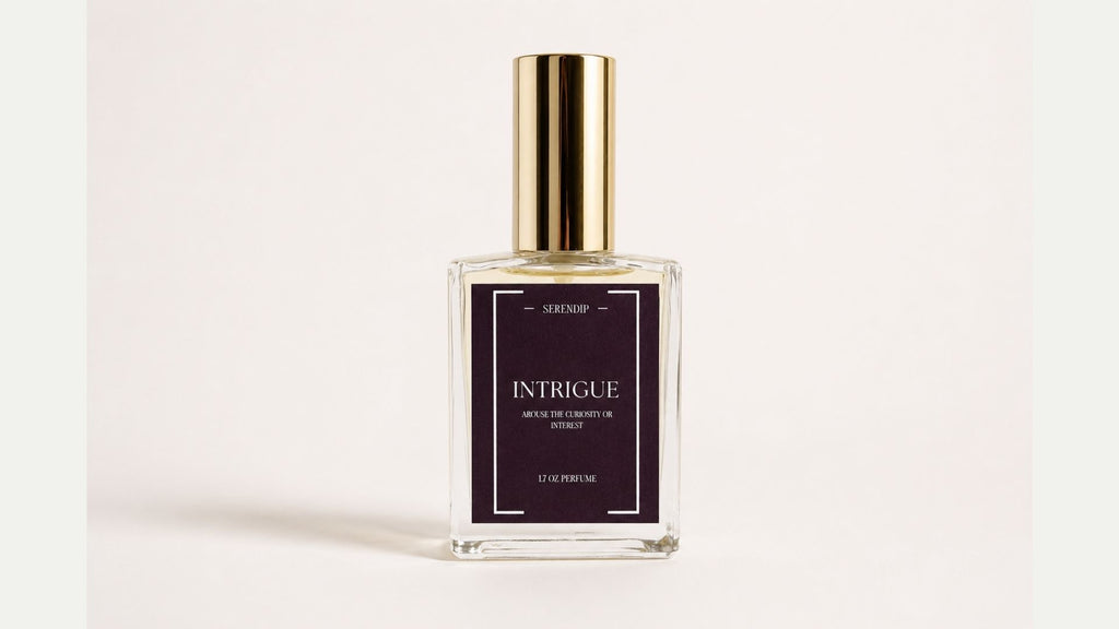 a bottle of perfume with a gold cap