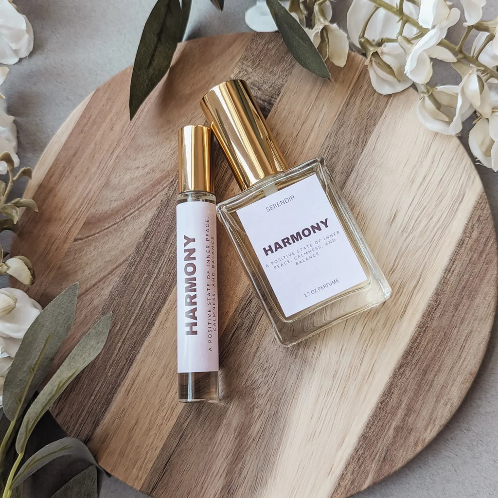a bottle of perfume on a wooden plate