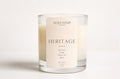 a glass candle with a label
