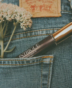a flower in a pocket of jeans